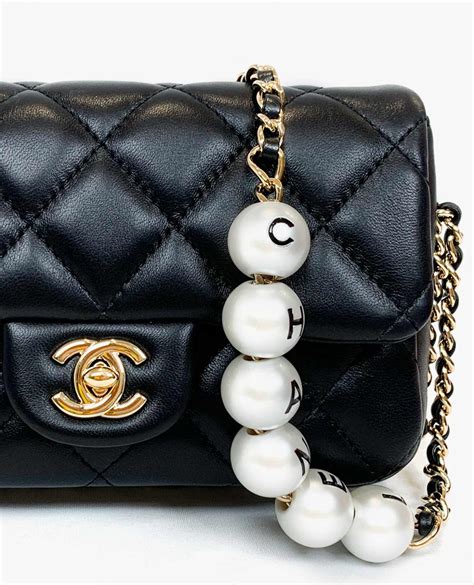 chanel pearl bag pink|Chanel bag with pearls strap.